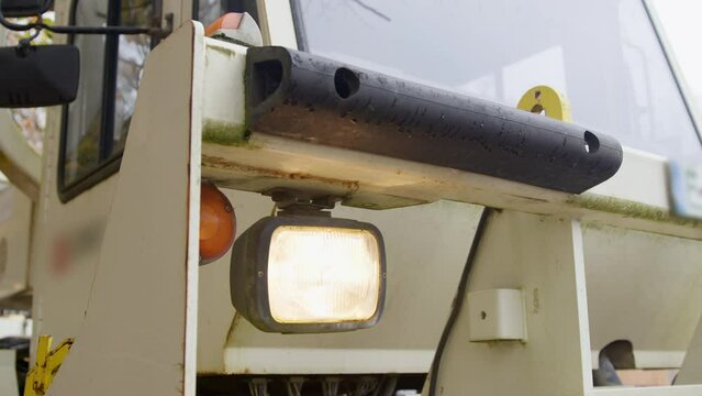High Resolution Video of a Vibro-Truck. It shows a close up of the front of the truck with focus on the headlight.