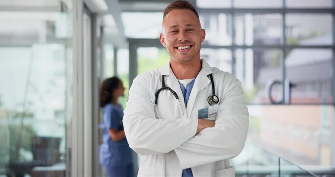 Doctor, man and arms crossed for healthcare on face, consultation service and medical professional. Happy male person, confidence and stethoscope for medicare in portrait, hospital and insurance