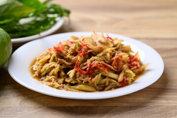 Thai food, Spicy mango salad with dry shrimp eating with fresh vegetables