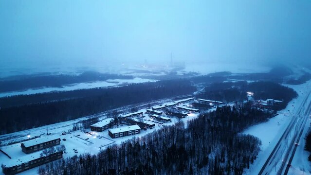 Aerial 4K Sunrise Blue Hour Morning Cinematic 4K Blizzard Snowfall Foggy Drone Shot of Arctic Winter Community Isolated Remote Mining Village Hub of the North Thompson Manitoba Canada Vale Inco Mine
