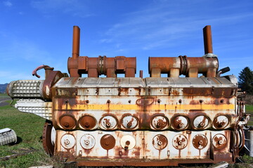 Diesel locomotive engine against clear blue sky.