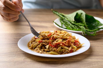 Thai food, Spicy mango salad with dry shrimp eating with fresh vegetables