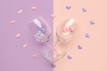 Composition with wine glasses for Valentine's day on lilac background