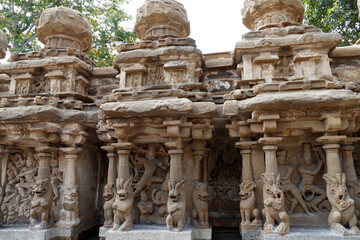 Small shrines with lion sculptures in the row of pillars in ancient Kanchi Kailasanathar temple in Kanchipuram, Tamil nadu. Sandstone carved mythical statues in Temple columns.