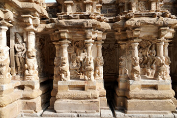 Small shrines with lion sculptures in the row of pillars in ancient Kanchi Kailasanathar temple in...