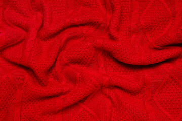 Texture of stylish knitted fabric with folds as background