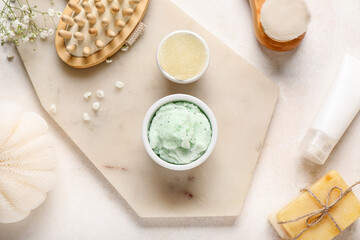 Composition with cosmetics and bath accessories on light background