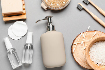 Composition with different bath supplies and cosmetics on grey background