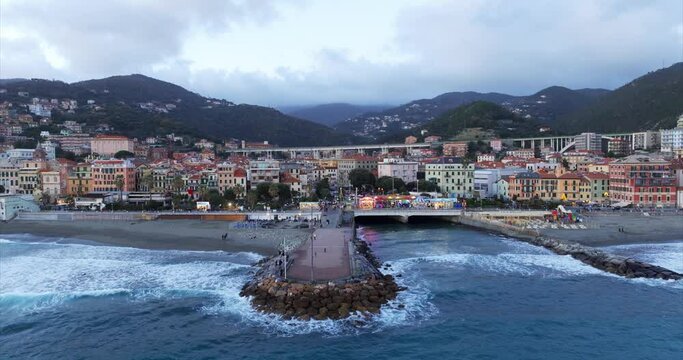 Breakwater at Varazze beach in Italy. Aerial drone backward view