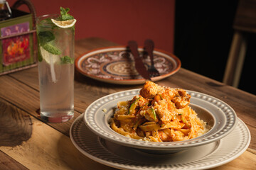 italian pasta next to a drink