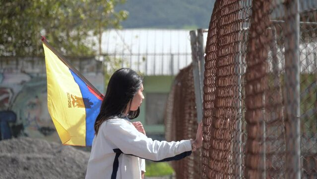 Young Latin American woman Ecuador flag hopeful for political change