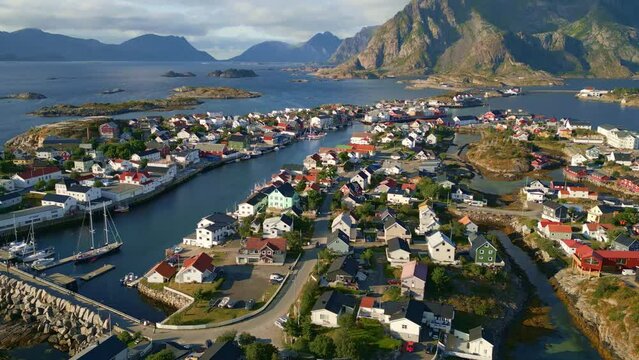 Drone flight over Henningsaer in the lofoten islands, revealing shot of the arctic village with beautiful backdrop