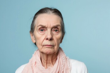 Concerned Senior Woman on a Solid Light Blue Background. Generative AI.
