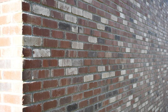 Multi colored brick wall, angled.