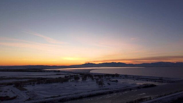4k Aerial Drone Snow-Capped Mountains Overlooking Willard Bay, Utah