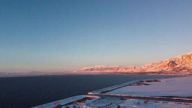 4k Aerial Drone Snow-Capped Mountains Overlooking Willard Bay, Utah