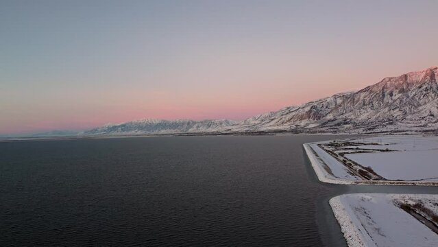 4k Aerial Drone Snow-Capped Mountains Overlooking Willard Bay, Utah