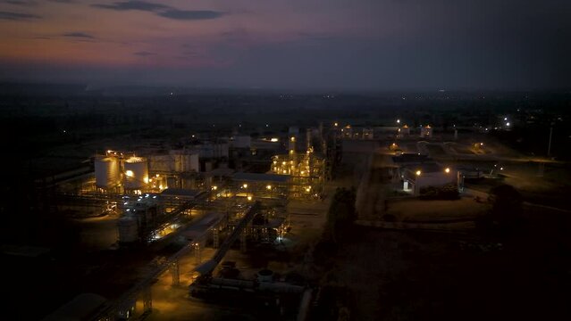 Drone shot aerial view scenic landscape of factoryl in the evening twilight