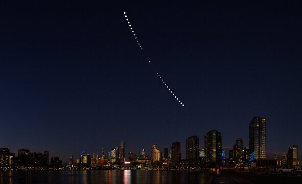 Composite image showing the progression of a total lunar eclipse over Melbourne, Australia.