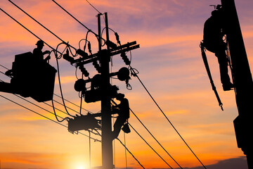 Silhouette of Electrician officer team climbs a pole and using a cable car to maintain a high voltage line system, Electrician lineman worker at climbing work on electric post power pole - obrazy, fototapety, plakaty