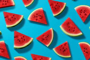 Slices of watermelon on blue wooden desk