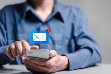 Email marketing concept. Person use smartphone with virtual email notification alert. Direct...