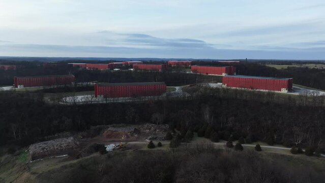 large red bourbon barrel rick houses in Frankfort Kentucky AERIAL TRUCKING PAN