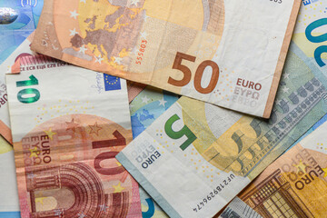 euro bills scattered on the table as a background 23