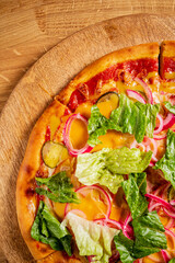 pizza with mozzarella on wooden background