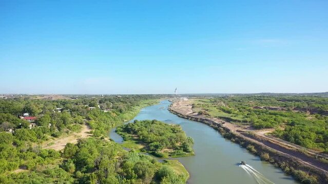 Border Patrol as they patrol the Rio Grande, the border between Mexico and the USA, utilizing a hovercraft