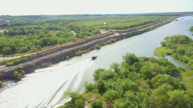 Border Patrol as they patrol the Rio Grande, the border between Mexico and the USA, utilizing a hovercraft