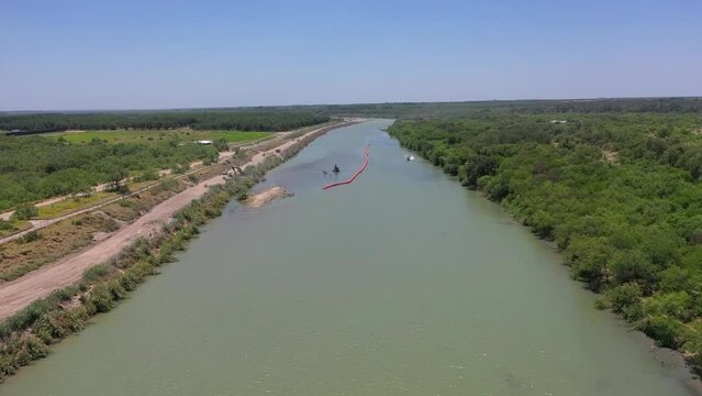 Border Patrol as they patrol the Rio Grande, the border between Mexico and the USA, utilizing a hovercraft
