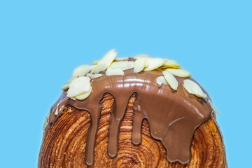 Cromboloni, Croissant Bomboloni. Round New York Roll with Chocolate Sauce and Almond Topping....