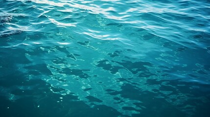 Fototapeta na wymiar Blue sea water surface with sun reflections. Shallow depth of field.