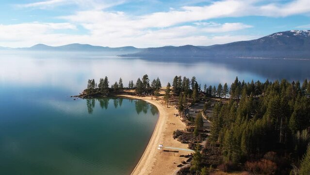 Aerial View of Sand Harbor Park and Lake Tahoe, Nevada USA, Pristine Landscape and Sky Mirror Reflection on Water