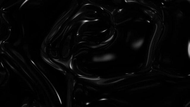 Slow motion of a liquid black mixture of oil.