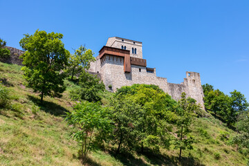 Fototapeta na wymiar Scenic view of Castle of Ragogna (Ruvigne) in Valeriano (Pinzano al Tagliamento), Friuli Venezia Giulia, Italy. Hill that overlooks river Tagliamento. Landmark on hill with blue sky background