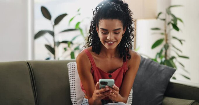 Typing, phone and woman relax in home and laugh at meme, funny post or girl on sofa with social media. Reading, ebook and person smile with happiness from internet, communication and online streaming