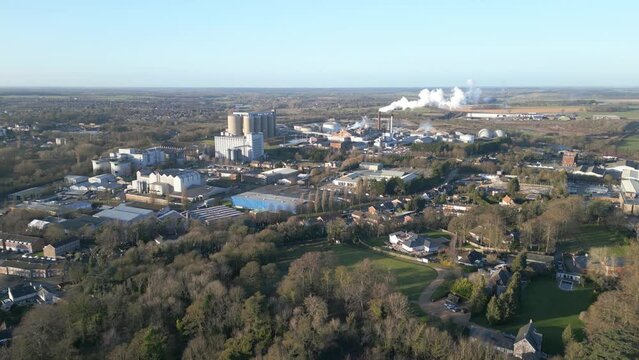 Bury st edmunds, england showcasing industrial complexes and green landscapes in daylight, aerial view