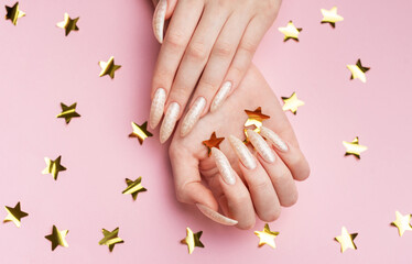 Hands with pearl manicure