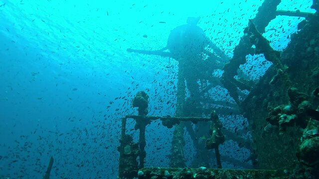 Footage of the HTMS Chang wreck off the coast of Koh Chang Island in Thailand. Underwater shots from below of the radar mast and stationary batfish inside the wreck.