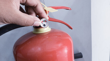 Check and inspection the pressure gauge valve  fire extinguisher, condition powder on the tube fire...
