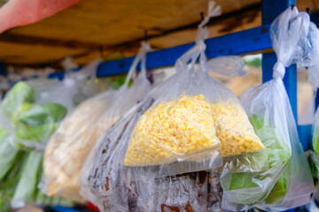 Traditional Market using scooter or motorcycle to sell daily fresh food supply vegetables in household. Sprouts in transparent plastic.