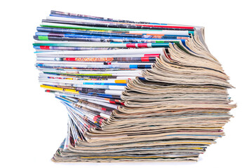 Pile of old paper colored magazines isolated on white background
