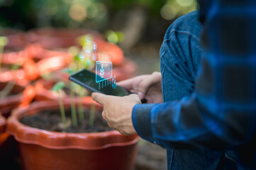 agriculture and modern technology Farmer using smart farming technologies using AI Check the growth of vegetables and fruits with smart farm technology