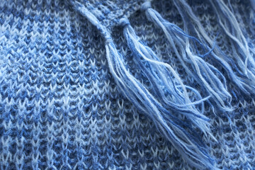 Knitted wool texture closeup. Knitted woolen background. Blue color