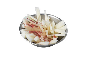 Sliced yam bean with chile and lime in a metal bowl.  Mexican snack. Jicama.