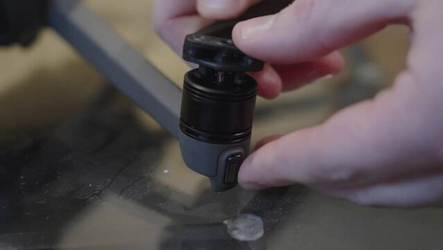 Placing wings onto the motor and rotor assembly.