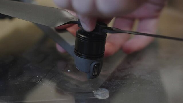Motor and wing repair in extreme close up.
