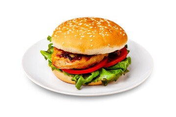 Burger, hamburger with chicken breast, tomato and lettuce on a plate. Isolated.